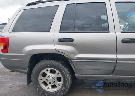 1999 Jeep Grand Cherokee Laredo из США, поврежденный, VIN 1J4GW58S1XC673530